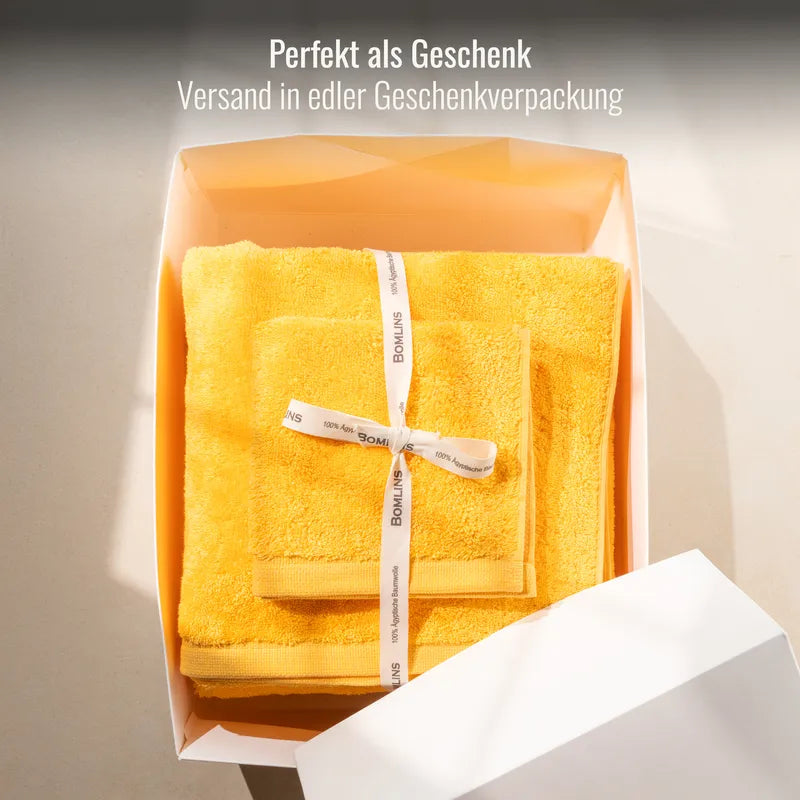 Handtuch Gelb als Geschenk verpackt