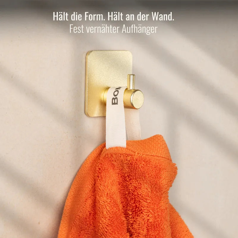 Aufhänger und Doppelnaht am Handtuch Orange